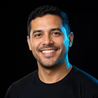 Daniel R., smiling, in a black T-shirt