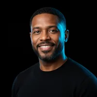 Marcus T., smiling, in a black T-shirt