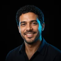 Omar S., smiling, in a black shirt